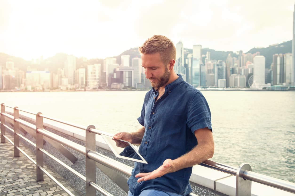 Expat using his tablet in Hong Kong